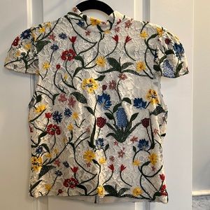 Alice and Olivia embroidered short sleeve blouse.